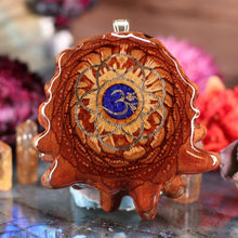 Load image into Gallery viewer, Crushed Lapis (Glows) with Gold Seed of Life and Front Om

