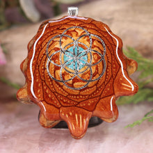 Load image into Gallery viewer, Crushed Turquoise (Glows) with Seed of Life
